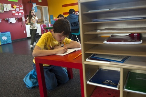 Chris Detrick | The Salt Lake Tribune 
Brandon Chow, 10, works on homework at the YMCA Community Family Center in Taylorsville on Wednesday, March 23, 2011.
