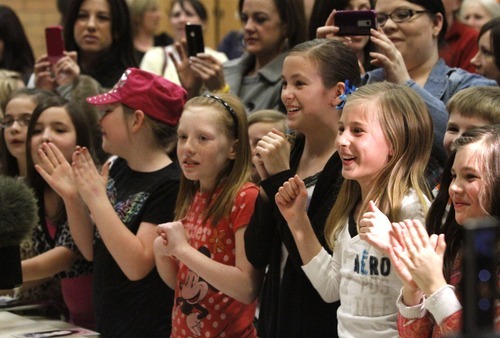 Rick Egan   |  The Salt Lake Tribune

Students and their mothers cheer and take photos of singer/actress Miranda Cosgrove at Crescent Elementary School in Sandy on Wednesday. Cosgrove, star of  TV show 