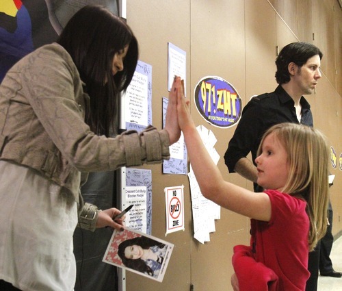 Rick Egan   |  The Salt Lake Tribune

5-year-old Alivia Boe gets a high-five from singer/actress, Miranda Cosgrove at Crescent Elementary School in Sandy on Wednesday. Cosgrove, star of  TV show 