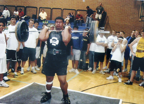 Scott Sommerdorf  |  The Salt Lake Tribune
Simi Fili lifts at a weightlifting camp at Cottonwood High. 
Fili, once a promising football star with a full-ride to Oregon, has spent his life trying to avoid the influence of the violent Glendale gang his uncle Miles Kinikini built -- the Tongan Crip Gang. Photo copied from his mother Le'o Fili's photo album, March 11, 2011.