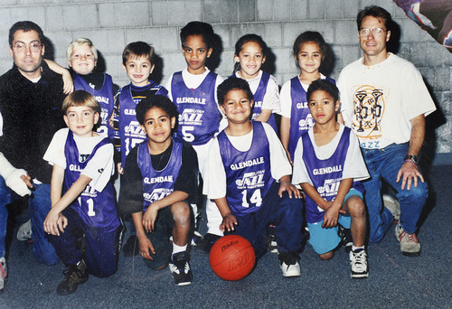 Scott Sommerdorf  |  The Salt Lake Tribune
Simi Fili (#14) shown in a team picture with other members of his little league basketball team. George Pupunu is #5 above him, Stanley Havili is to Fili's left and is now playing football at USC. Marcus Mailei is to Fili's left and is playing in the NFL. 
Fili, once a promising football star with a full-ride to Oregon, has spent his life trying to avoid the influence of the violent Glendale gang his uncle Miles Kinikini built -- the Tongan Crip Gang. 
Photo copied from his mother Le'o Fili's photo album, March 11, 2011.