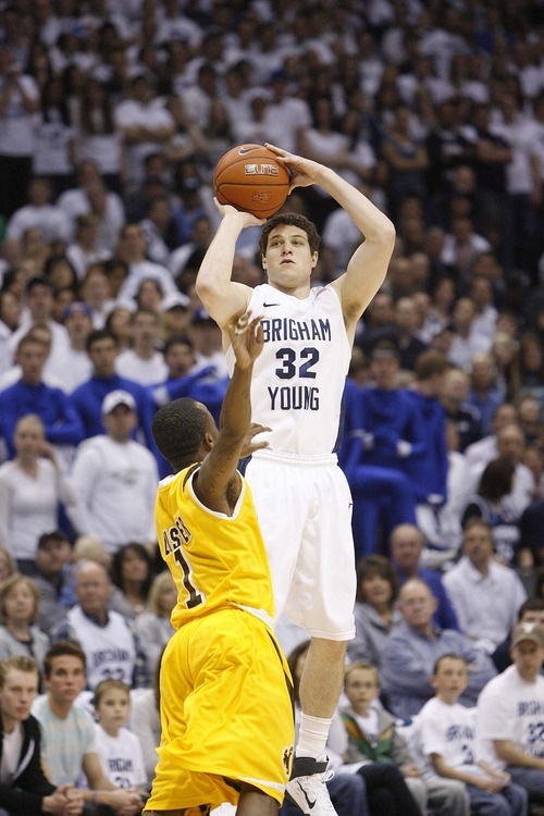 Trent Nelson  |  The Salt Lake Tribune
BYU's Jimmer Fredette shoots a three as BYU hosts Wyoming, college basketball in Provo, Utah, Saturday, March 5, 2011. Defending is Wyoming's JayDee Luster.