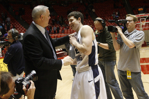 Chris Detrick  |  The Salt Lake Tribune 

Jimmer Fredette jokes around with coach Dave Rose after a BYU victory this season.