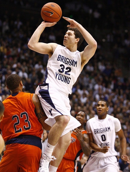 Djamila Grossman  |  The Salt Lake Tribune

Jimmer Fredette hits a 3-pointer, pushing aside UTEP's Gabriel McCulley, in a Dec. 23, 2010 game in Provo.