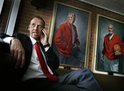 Scott Sommerdorf  |  The Salt Lake Tribune
Larry Krystkowiak, the new men's basketball coach at the University of Utah, does a radio interview near the portraits of former Utah football coach Isaac Armstrong and former Utah basketball coach Vadal Peterson after a press conference held at the university Monday.