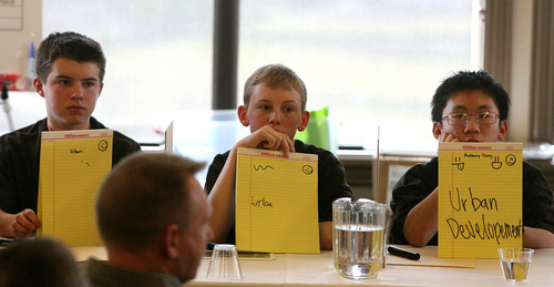 Leah Hogsten  |  The Salt Lake Tribune
Ayden Olsen, left, Salem Karren and Anthony Cheng compete in the 2011 National Geographic Bee. They answered geographical questions at Lehi's Thanksgiving Point in the annual competition  for the honor of representing Utah in the national competition held in Washington, D.C., at the end of May.