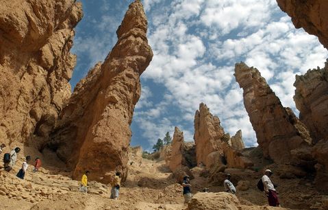 AL HARTMANN | Tribune File Photo
Hikers are dwarfed by the tall red spires as they descend the the Wall Street section on the Navajo Loop Trail, the most popular trail in Bryce National Park. Bryce and Utah's other national parks could be closed if Congress and the White House can't strike a deal on funding federal agencies.