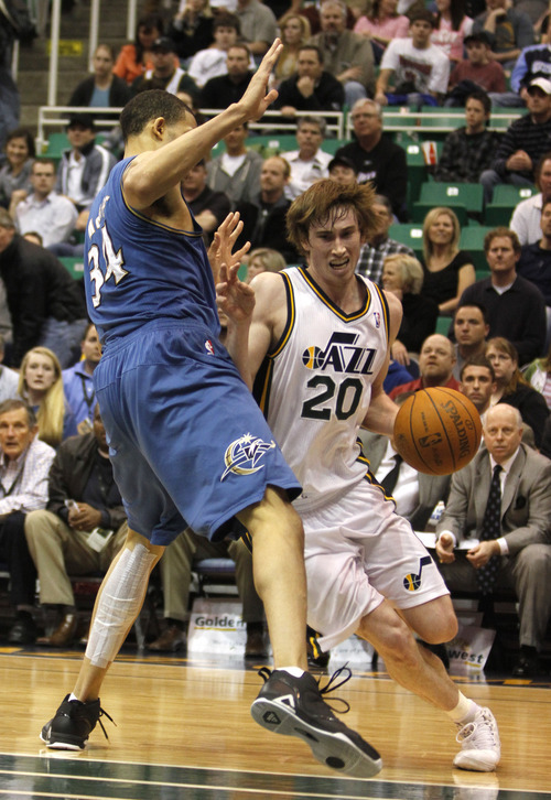 Rick Egan   |  The Salt Lake Tribune


Utah Jazz forward Gordon Hayward (20)    takes the ball inside, as Washington Wizards center JaVale McGee (34)defends, in NBA action Utah vs Washington, in Salt Lake City, Monday, March 28, 2011. Wall was held scoreless in the second half of regulation play.