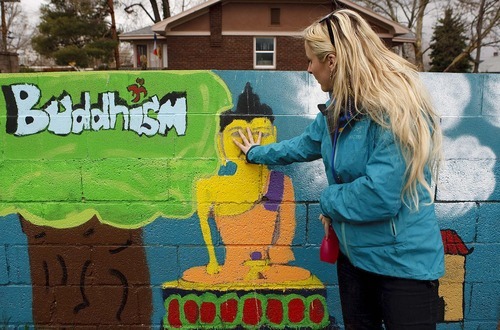Trent Nelson  |  The Salt Lake Tribune
Jessi Cummings, a school teacher who lives in South Salt Lake, had a problem with gang graffiti on the wall surrounding her house. She decided to have some of her students at Taylorsville High paint over the graffiti with a mural of world religions.