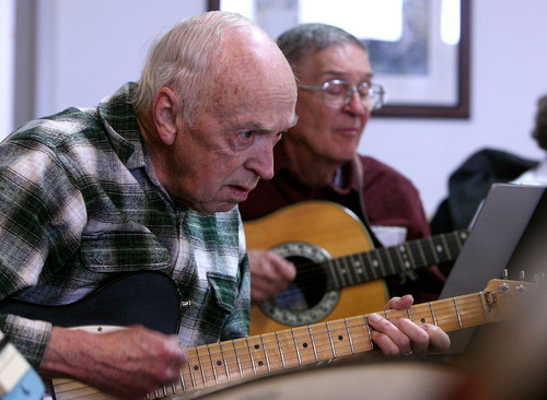 Leah Hogsten  |  The Salt Lake Tribune
Electric guitarist George Best, left, and guitarist Kip Maxwell play nonstop for nearly two hours at Sante Assisted Living in Bountiful April 8. The Golden Years Jazz Band, composed of seniors, plays every Friday at a different Bountiful care center. The band has been entertaining crowds for 32 years.