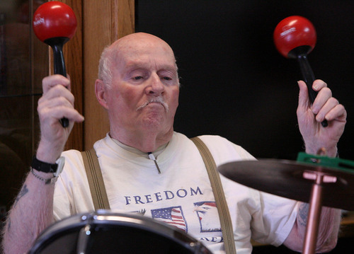 Leah Hogsten  |  The Salt Lake Tribune
Percussionist Chuck Allen also gets help from the crowd as they are encouraged to play percussion instruments along with the Golden Years Jazz Band.