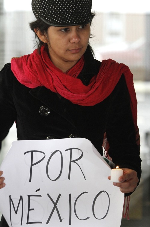 Rick Egan   |  The Salt Lake Tribune

Stefany Marquez, of Guernavaca, Mexico, holds a sign during a demonstration Wednesday outside the Mexican consulate in Salt Lake City to show solidarity with the victims of the drug war in Mexico.