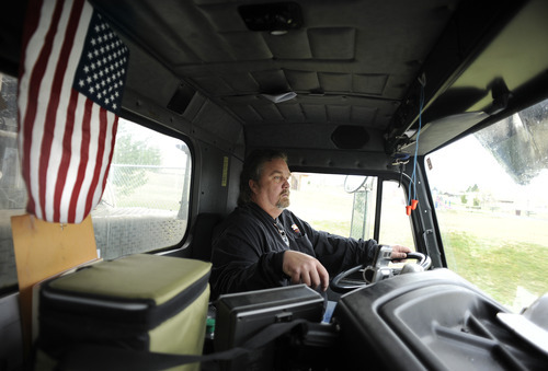 Sarah A. Miller  |  The Salt Lake Tribune

Salt Lake County garbage truck driver John Whittaker, 54, of Kearns works on his Salt Lake Valley route Tuesday April 12, 2011 in Kearns. Whittaker flies to Dallas next month to be recognized as national truck driver of the year in the public sector by the National Solid Wastes Management Association.