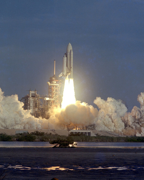 The space shuttle Columbia clears the pad on its way into orbit after liftoff at the Kennedy Space Center in Cape Canaveral, Fla. on April 12, 1981. (AP Photo/NASA)