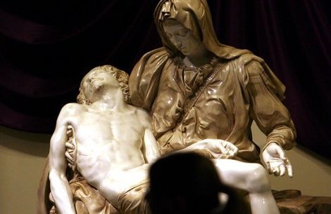 Steve Griffin  |  The Salt Lake Tribune
University of Utah student Melissa Anderson admires a replica of Michelangelo's Pieta -- now on display at St. Catherine of Siena Newman Center in Salt Lake City.