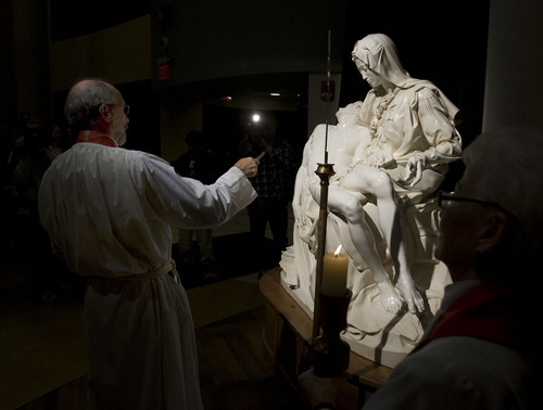 Steve Griffin  |  The Salt Lake Tribune
Father Lincoln Ure, director of pastorial care at St. Mark's Hospital, blesses a replica of Michelangelo's Pieta. It was unveiled Nov. 9, 2010. The sculpture was temporarily donated to the hospital to be displayed in the main lobby for the rest of 2010.