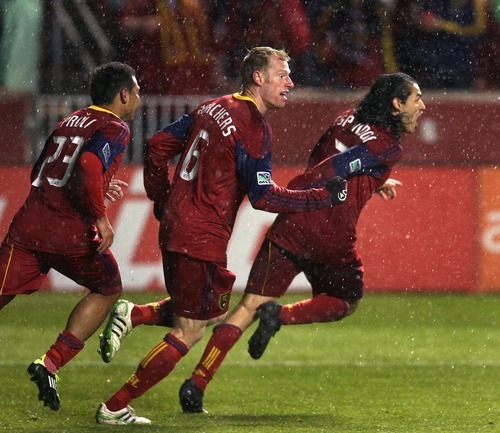 Steve Griffin  |  The Salt Lake Tribune
 
Real Salt Lake's Fabian Espindola, right, is chased by his teammates after scoring the winning goal in extra time in the Real Salt Lake versus Colorado Rapids at Rio Tinto Stadium in Sandyon Wednesday, April 13, 2011.