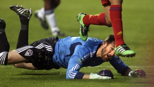 Steve Griffin  |  The Salt Lake Tribune
 
Real Salt Lake's Alvaro Saborio leaps over Colorado goalie Matt Pickens as he chases after the ball during first half action in the Real Salt Lake versus Colorado Rapids at Rio Tinto Stadium in Sandy, Utah Wednesday, April 13, 2011.