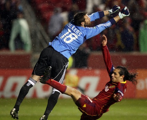 Steve Griffin  |  The Salt Lake Tribune
 
Colorado's Matt Pickens punches the ball away from a diving Real Salt Lake's Fabian Espindola during second half action in the Real Salt Lake versus Colorado Rapids at Rio Tinto Stadium in Sandy, Utah Wednesday, April 13, 2011.