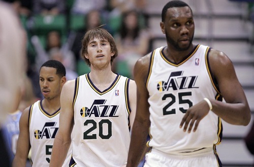 Djamila Grossman  |  The Salt Lake Tribune

The Utah Jazz' Devin Harris (5), Gordon Hayward (20) and Al Jefferson (25) walk off the court during a time out in a game against the Denver Nuggets at Energy Solutions Arena in Salt Lake City, Utah, on Wednesday, April 13, 2011.