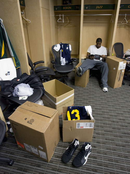 Steve Griffin  |  The Salt Lake Tribune
 
Jazz rookie Derrick Favors reads a magazine as he waits for his end-of-the-season interview during locker clean-out day at EnergySolutions Arena in Salt Lake City on Thursday, April 14, 2011. The team finished its season last night and will not be going to the playoffs.