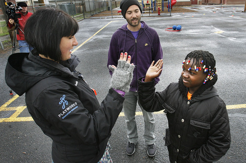 Scott Sommerdorf  |  The Salt Lake Tribune
Violet Uwiegyana gives a high five to Playworks coach Abby Rotwein before Uwiegyana helps out as a 
