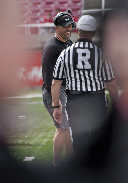 Michael Mangum  |  The Salt Lake Tribune

Utah head coach Kyle Whittingham finds a moment to laugh with the referees during a spring practice session at Rice-Eccles Stadium on Monday, April 11, 2011.
