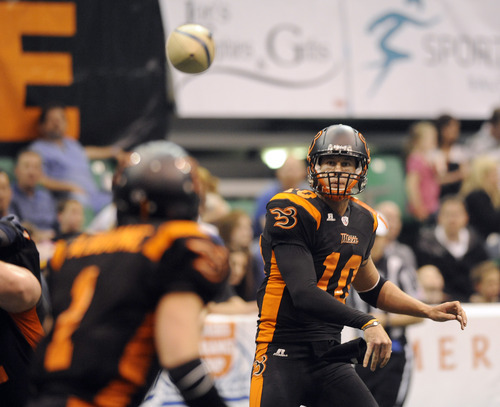 Sarah A. Miller  |  The Salt Lake Tribune

Utah Blaze quarterback Tommy Grady makes a pass to Aaron Boone Friday night at Energy Solutions Arena in downtown Salt Lake City.