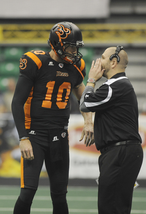 Sarah A. Miller  |  The Salt Lake Tribune

Utah Blaze offensive coordinator Matt Sauk talks with quarterback Tommy Grady during the first quarter of their game against the Spokane Shock Friday night at Energy Solutions Arena in downtown Salt Lake City.