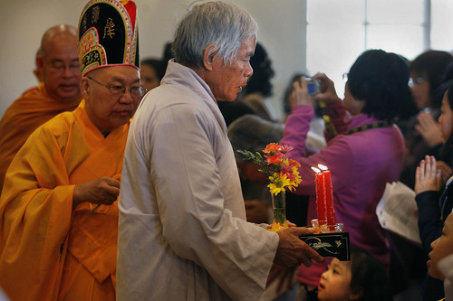 Scott Sommerdorf  |  The Salt Lake Tribune
After the first ceremony in the newly opened Lien Hoa Buddhist Temple, the procession makes it's way through the worshippers to the front door. Lien Hoa Buddhist Temple opened Sunday after a decade of planning, in West Valley CIty Sunday, April 17, 2011.