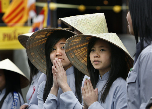 Scott Sommerdorf  |  The Salt Lake Tribune
Members of the Lien Hoa Buddhist Temple's congregation wait for the opening procession of visiting monks to begin. The temple opened Sunday in West Valley CIty Sunday, April 17, 2011.