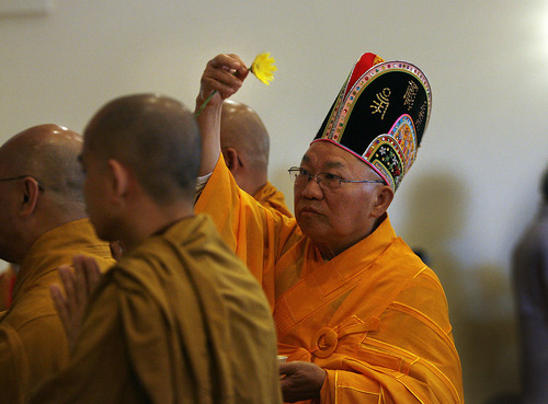 Scott Sommerdorf  |  The Salt Lake Tribune
Buddhist Monk, Thich Tri Lang, of the Unified Vietnamese Buddhist Congregation in the United States, uses a Chrsanthemum to consecrate the Temple during a ceremony at the Lien Hoa Buddhist Temple which opened Sunday in West Valley City, Sunday, April 17, 2011.