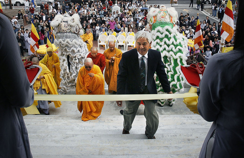 Scott Sommerdorf  |  The Salt Lake Tribune
Te Phan (center) leads the procession up the stairs of the Lien Hoa Buddhist Temple to cut the ceremonial ribbon. Phan hopes the temple will be a gathering place for Vietnamese Americans and for others interested in the Buddhist faith. Phan also teaches youths in his community about Vietnamese culture and avoiding drugs and violence. Lien Hoa Buddhist Temple opened Sunday in West Valley CIty Sunday, April 17, 2011.