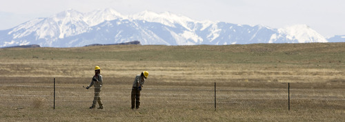 Al Hartmann   |  The Salt Lake Tribune 
August Koehler of Logan, left, and Shane Nelson of Colorado Springs, Colo., members of the Canyon Country Youth Corps, build a fence for the Bureau of Land Management in the open grazing country just south of I-70 near Moab on Monday, April 11.     President Obama's outdoor initiative calls for more outdoor jobs for youths.