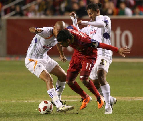 Leah Hogsten  |  The Salt Lake Tribune
Real Salt Lake's  Javier Morales battles Saprissa's Douglas Sequeira (left) and Armando Alonso (right). Real Salt Lake  played the first  its two-game series against Saprissa of Costa Rica in the CONCACAF Champions League at Rio Tinto Stadium  Tuesday March 15, 2011.