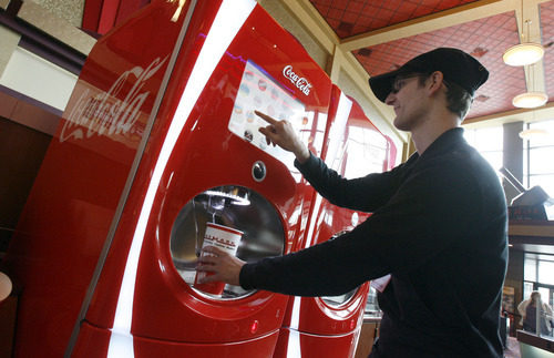 Francisco Kjolseth  |  The Salt Lake Tribune
Quinn Durrant demonstrates all the soda combinations at the Century 16 theater in Sandy on Tuesday, April 12, 2011, where four new high-tech soda fountains deliver 106 flavors. With a touch screen, customers can mix and match to make up their favorite flavors. Salt lake was one of the first cities to test it.
