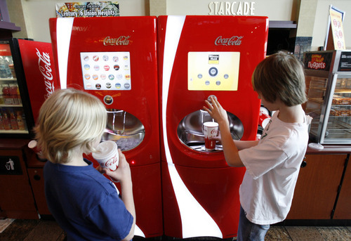 Francisco Kjolseth  |  The Salt Lake Tribune
Ben Zitting, 10, left and his brother Cameron fill up on their favorite soda flavors at the Century 16 theater in Sandy on Tuesday, April 12, 2011, where four new high-tech soda fountains deliver 106 flavors. With a touch screen, customers can mix and match to make up their favorite flavors. Salt lake was one of the first cities to test it.