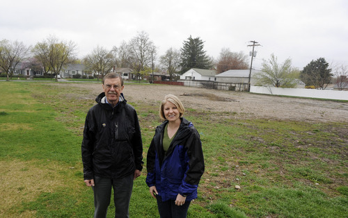 Sarah A. Miller  |  The Salt Lake Tribune

Neighbors Ben Burdett and Sally Barraclough stand in the vacant lot they hope to buy from the LDS church to build a neighborhood park. They plan to raise money to purchase the land and build a playground.