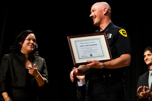 CHRIS DETRICK  |  Tribune File Photo
Salt Lake City Police Chief Chris Burbank criticizes the immigration laws enacted by the governor and Utah Legislature -- saying they will negatively impact law enforcement, citizen rights and the immigrant community. The laws were tempered, he said, by the Utah Compact. This photo from last year shows Burbank receiving an award presented by Sen. Luz Robles at the Latino Community Center.