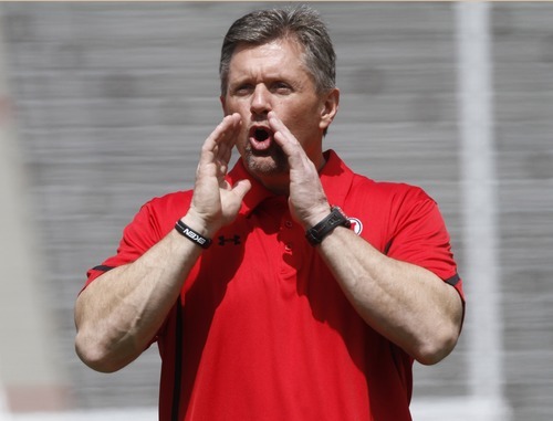 Rick Egan   |  The Salt Lake Tribune

Head coach Kyle Whittingham cheers his players during the Utes' spring scrimmage, Saturday, April 16, 2011.