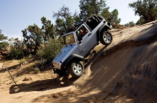 Djamila Grossman  |  The Salt Lake Tribune

Rob Covert drives a Jeep on the Fins & Things 4x4 trail near Moab on Saturday, Oct. 2, 2010.