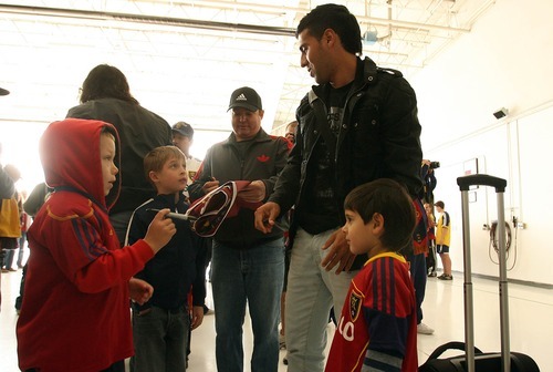 Leah Hogsten  |  The Salt Lake Tribune
Real Salt Lake's Javier Morales signs autographs for fans greeting the team. Real Salt Lake was greeted by about 60 fans when the team landed at Million Air Terminal in Salt Lake City on Thursday, April 21, 2011. The Major League Soccer team returned from a 2-2 tie Wednesday against Mexican champions Monterrey in the first leg of the CONCACAF Champions League Final.