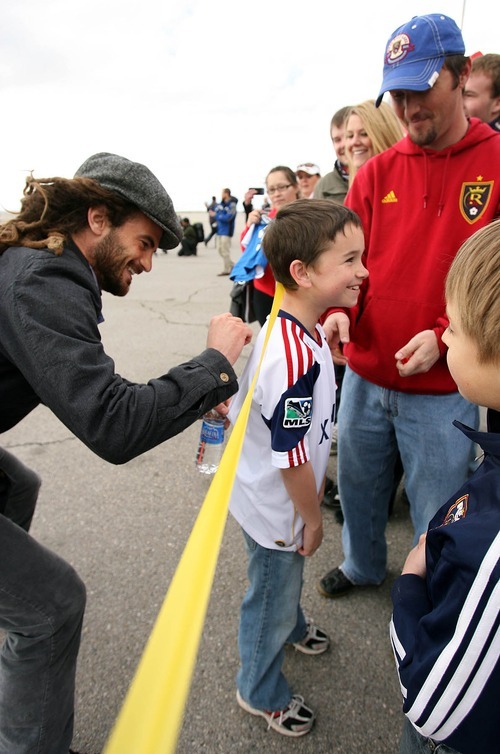 Leah Hogsten  |  The Salt Lake Tribune
Real Salt Lake's Kyle Beckerman signs the shirt of Kobi Bird. Real Salt Lake was greeted by about 60 fans when the team landed at Million Air Terminal in Salt Lake City on Thursday, April 21, 2011. The Major League Soccer team returned from a 2-2 tie Wednesday against Mexican champions Monterrey in the first leg of the CONCACAF Champions League Final.