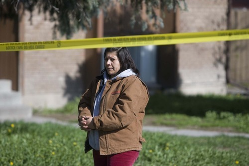 Jeremy Harmon  |  The Salt Lake Tribune

Maria Gonzalez stands outside an apartment complex at the scene of an apparent double homicide in South Salt Lake on Friday, April 22, 2011. Her brother-in-law said he found the bodies of two of his roommates inside their apartment earlier in the morning.