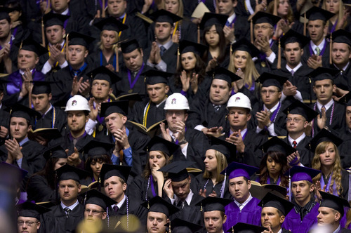 Al Hartmann  |  The Salt Lake Tribune 
Weber State University graduates applaud in the Dee Events Center on Friday, April 22 during graduation.   Three graduates in hard hats are graduating in construction technology.