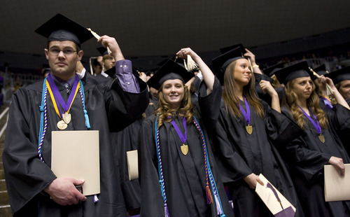 Al Hartmann  |  The Salt Lake Tribune 
Weber State University graduates move their tassels to signify their graduation during Weber State University's commencement  on Friday, April 22.