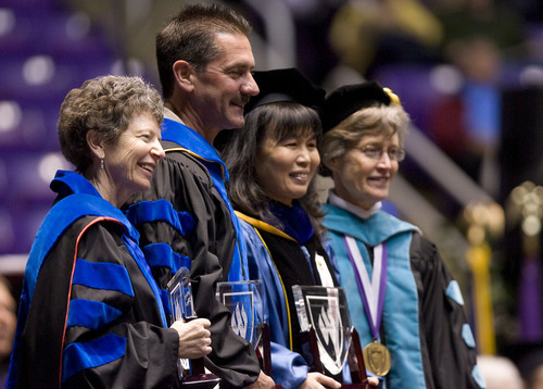 Al Hartmann  |  The Salt Lake Tribune 
Graduate students Judy Eisley, left, Brooke Arkush and Yu-Jane Yang were awarded the Presidential Distinguished Professors Awards by Ann Milner, president of Weber State University, at right, in the Dee Events Center on Friday, April 22, for the university's 137th commencement.