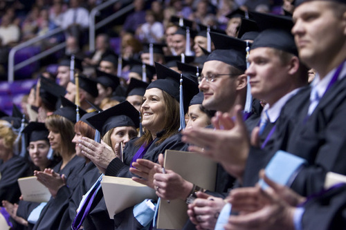 Al Hartmann  |  The Salt Lake Tribune 
Weber State University graduates applaud in the Dee Events Center on Friday, April 22, for the university's 137th commencement.