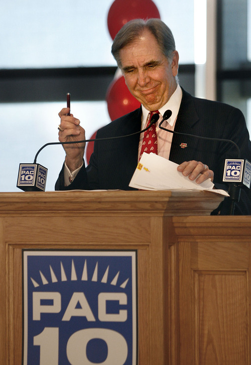 Scott Sommerdorf  |  Salt Lake Tribune
UTAH JOINS PAC-10
University of Utah President Michael Young displays the pen he used to sign the Pac-10's invitation forms on the podium at the press conference after the board's acceptance vote. The University of Utah officially accepted the offer to join the Pac-10 conference Thursday 6/17/10.