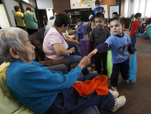 Francisco Kjolseth  |  The Salt Lake Tribune
Ruth Oka, an Alzheimer's patient at the Riverside Adult Day Center in Salt Lake City, reaches out to say goodbye to Eric De La Paz, 4, during a Thursday visit between seniors and preschoolers.